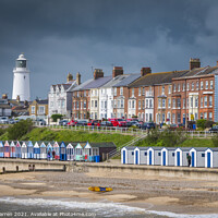Buy canvas prints of Beach huts and lighthouse Southwold Suffolk by Chris Warren