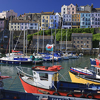 Buy canvas prints of Welsh flag on a boat flying in Tenby harbour by Chris Warren