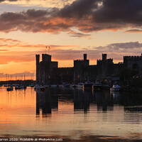 Buy canvas prints of Caernarfon Castle at Sunset by Chris Warren
