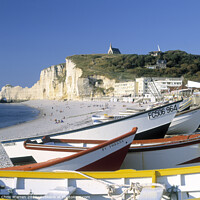 Buy canvas prints of Colourful boats at Etretat France by Chris Warren