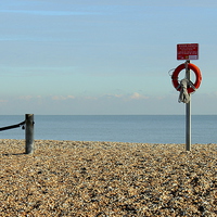 Buy canvas prints of Greatstone Beach, Red Lifebuoy. by Robert Cane