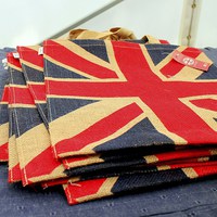 Buy canvas prints of Canvas bags in Red Cross tent. by Robert Cane