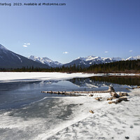 Buy canvas prints of Serene Winter Wonderland - Vermilion Lake Mountain Reflection by rawshutterbug 