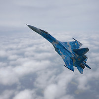 Buy canvas prints of SU-27 Flanker Above The Clouds by rawshutterbug 