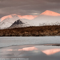 Buy canvas prints of Golden Sunrise over Frozen Loch by Robert Strachan