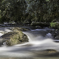Buy canvas prints of A small waterfall at the head of Lake Garda by Ray Hill