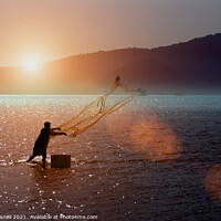 Buy canvas prints of A Thai fisherman at sunrise by Jim O'Donnell