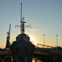 Buy canvas prints of Setting sun Behind HMS Cavalier  by Mike Gwilliams