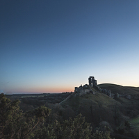 Buy canvas prints of Corfe Castle cloudless sunrise by Kevin Browne