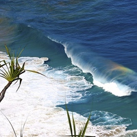 Buy canvas prints of Rainbow in The Waves by Bella Perroni