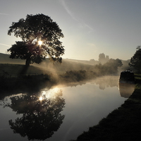 Buy canvas prints of Canal Sunrise by Ralph Jackson