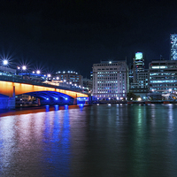 Buy canvas prints of London Bridge and the City at Night by John Ly