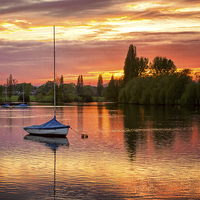 Buy canvas prints of  Dramatic Sunset at Danson Park by John Ly