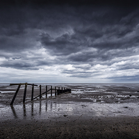 Buy canvas prints of  A moody day at the beach. by John Ly