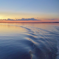 Buy canvas prints of A Boats wake reflection. by Jeffrey Evans