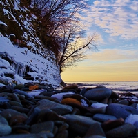 Buy canvas prints of A rocky winter sunset. by Jeffrey Evans
