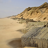 Buy canvas prints of Tank Traps on Beach by Eric Watson