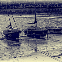 Buy canvas prints of Beached Boats Blues by Graham Beerling