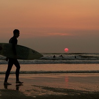 Buy canvas prints of Silhouette of a surfer by Helen Cooke