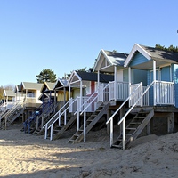 Buy canvas prints of Beach huts at Wells next the sea by Helen Cooke