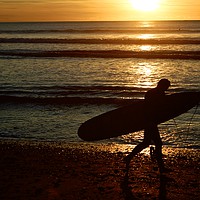 Buy canvas prints of Surfer at sunset by Helen Cooke