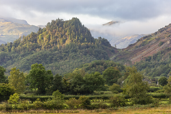 Early morning sun on Castle Crag Picture Board by Keith Douglas