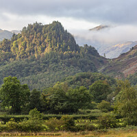 Buy canvas prints of Early morning sun on Castle Crag by Keith Douglas