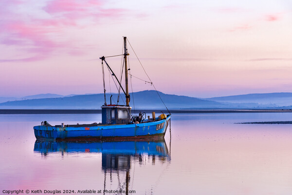 Blue boat, purple sky in Morecambe Bay Picture Board by Keith Douglas