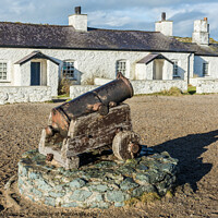 Buy canvas prints of Cannon and the Pilots' Cottages, Llanddwyn Island, by Keith Douglas