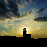Buy canvas prints of Sunset behind the lighthouse by Laco Hubaty