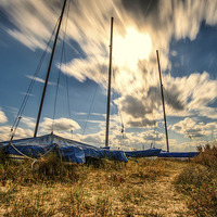 Buy canvas prints of  Static Boats Moving Sky by matthew  mallett