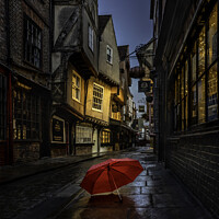 Buy canvas prints of Red Umbrella On The Pavement Of The Shambles by Inca Kala