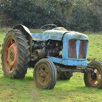 Buy canvas prints of Old Blue Tractor by Robert Maddocks
