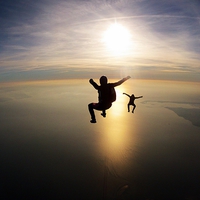 Buy canvas prints of skydive sunset over the bay by Ewan Cowie