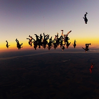 Buy canvas prints of sunset large freefly formation skydive by Ewan Cowie