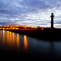 Buy canvas prints of Whitby harbour by night by Colin Brittain