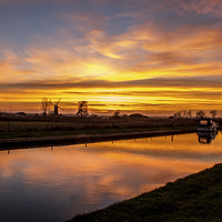 Buy canvas prints of Sunset Thurne Dyke Norfolk Broads by James Taylor