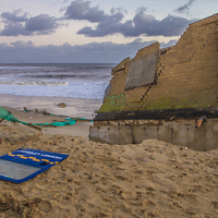 Buy canvas prints of Hemsby Beach Old Lifeboat Shed After Surge by James Taylor