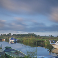 Buy canvas prints of  Martham Boat Yard Moving Clouds by James Taylor