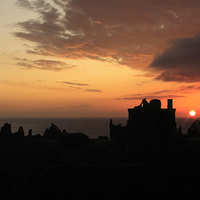 Buy canvas prints of Majestic Sunrise at Dunnottar Castle by Tommy Dickson