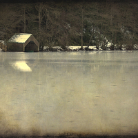 Buy canvas prints of Winter Wonderland A Frozen Loch and Boathouse by Tommy Dickson