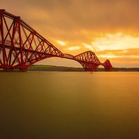 Buy canvas prints of Tranquil Sunset Over Iconic Forth Rail Bridge by Tommy Dickson