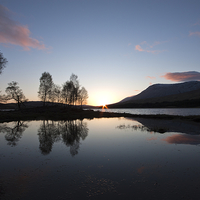 Buy canvas prints of Serene Sunrise Over Scottish Loch by Tommy Dickson