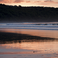 Buy canvas prints of Riding the Waves of Cayton Bay by Tommy Dickson