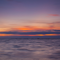 Buy canvas prints of Vibrant Seascape at Sunset by Tommy Dickson
