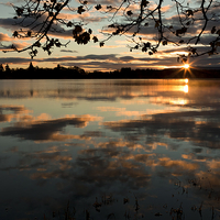 Buy canvas prints of Serene Sunrise over Scottish Lake by Tommy Dickson