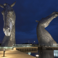 Buy canvas prints of Illuminated Kelpies at Night by Tommy Dickson