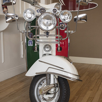 Buy canvas prints of Iconic Italian Vespa Scooter by Tommy Dickson