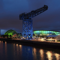 Buy canvas prints of Glasgows Vibrant Night Skyline by Tommy Dickson