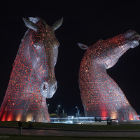 Buy canvas prints of The Enchanting RedLit Kelpies by Tommy Dickson